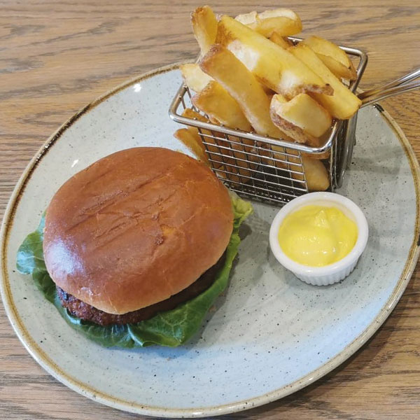 Katsu curried pork burger served with hand cut chunky chips & curried mayonnaise